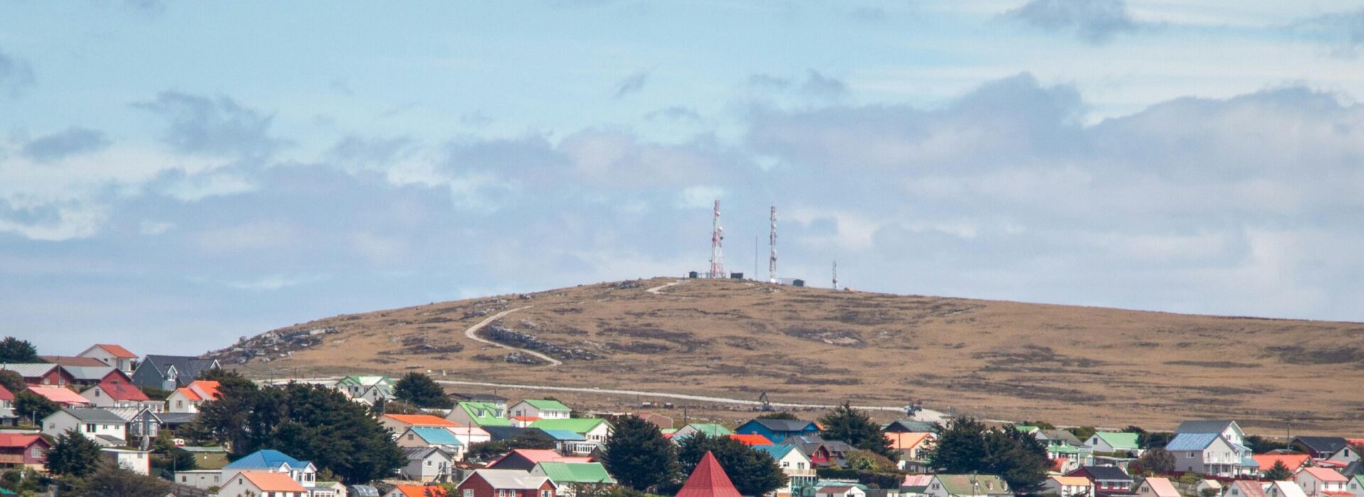 Charming harbor view of Stanley with colorful Victorian houses in the Falkland Islands.