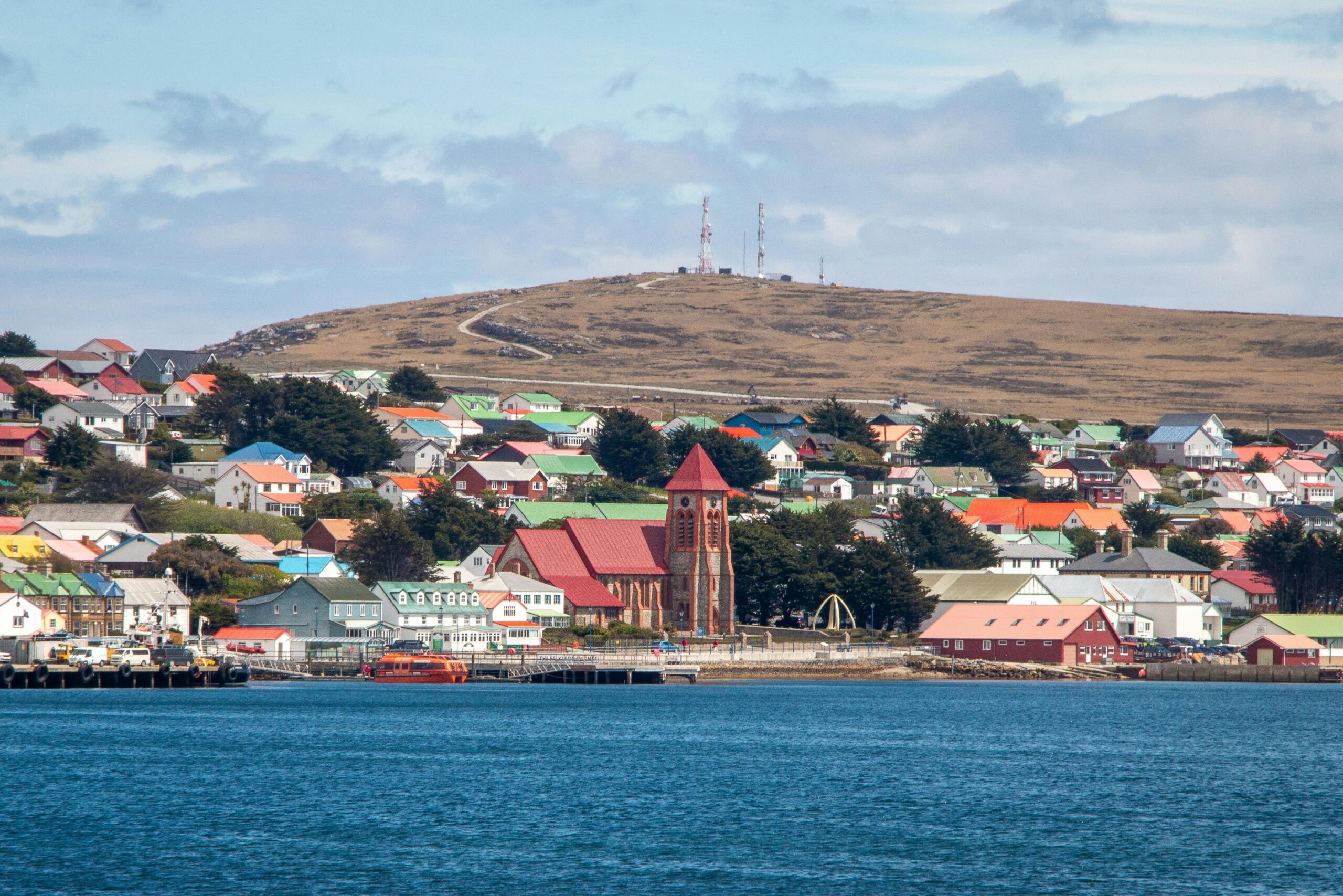 Charming harbor view of Stanley with colorful Victorian houses in the Falkland Islands.
